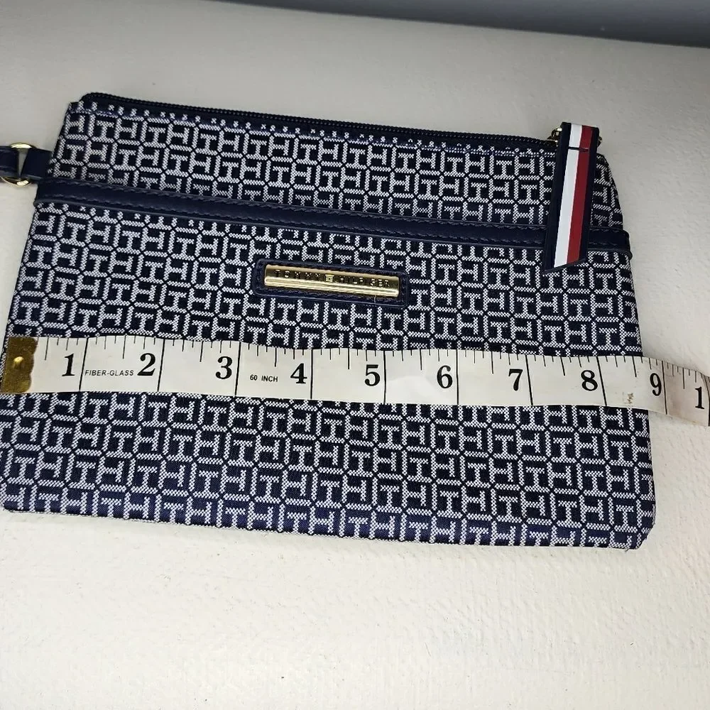 Tommy Hilfiger Wristlet Blue And White with red accents.